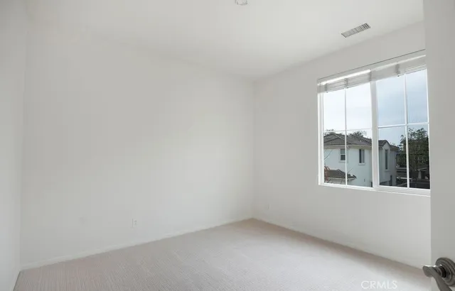 a view of a lounge chair and table in the house