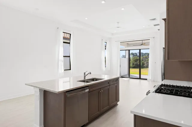a kitchen with a sink and a stove