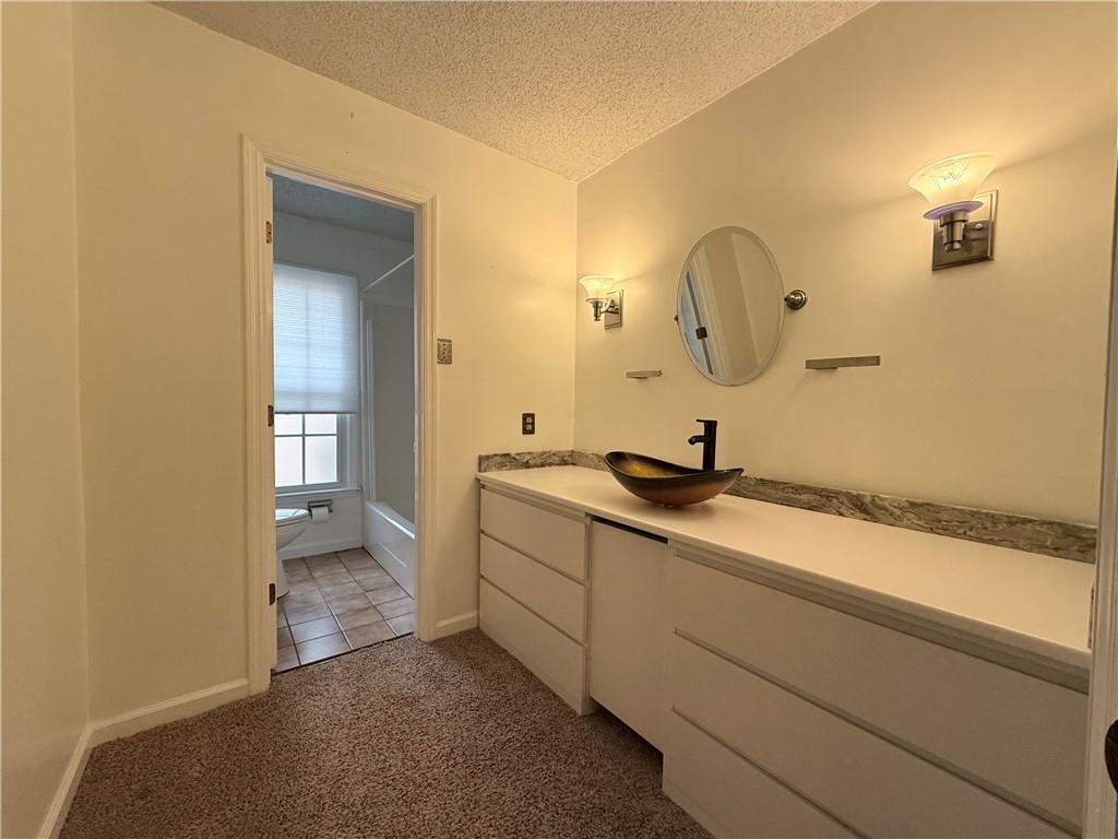 3033 Riviera Drive Conyers, GA 30012 - Photo 25 of 79 a bathroom with a sink and a mirror
