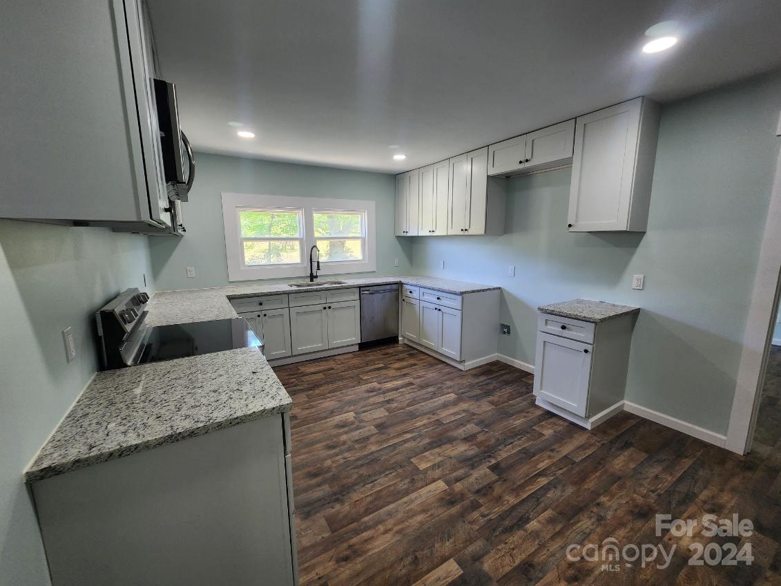 1004 Columbia Road Chester, SC 29706 - Photo 7 of 15 a kitchen with a sink stove and cabinets