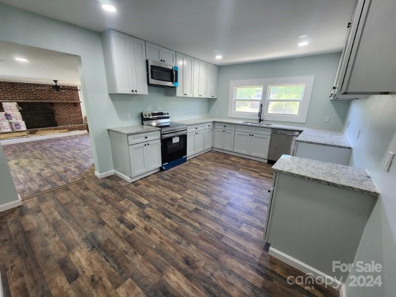 1004 Columbia Road Chester, SC 29706 - Photo 8 of 15 a large kitchen with a stove a sink and a refrigerator
