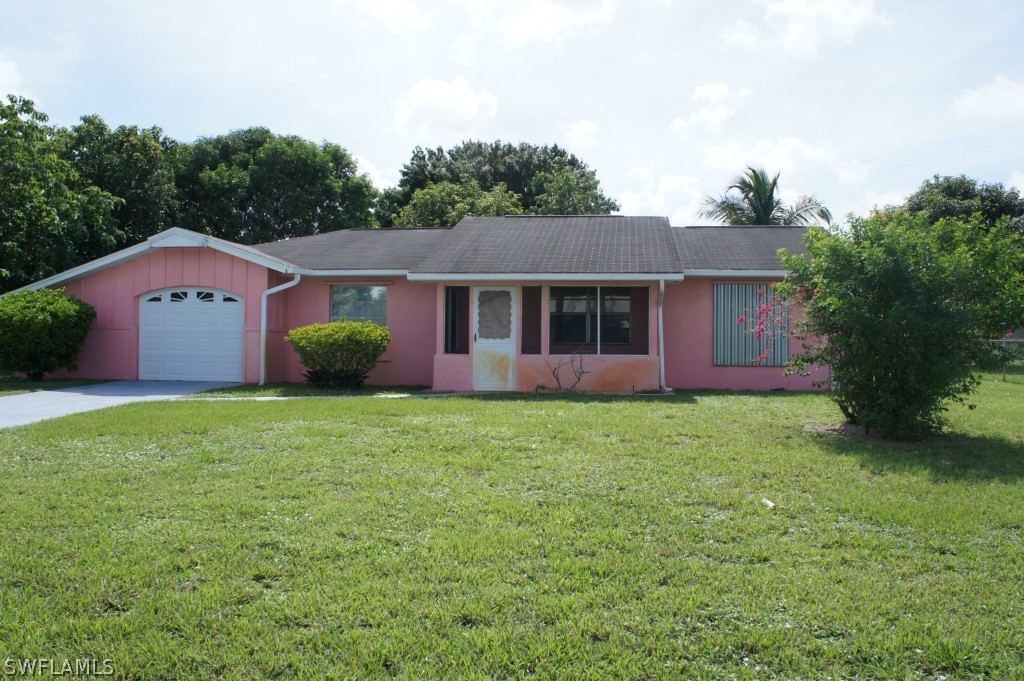 118 Rowland Road Lehigh Acres, FL 33936 - Photo 1 of 19 a view of a house with a backyard