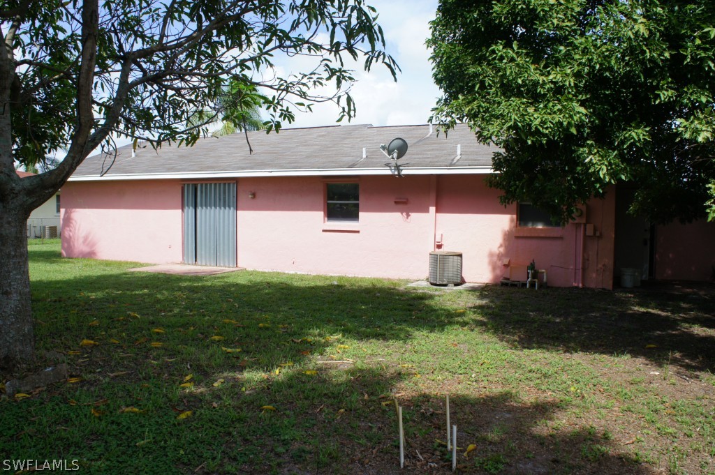 118 Rowland Road Lehigh Acres, FL 33936 - Photo 5 of 19 a view of house with backyard