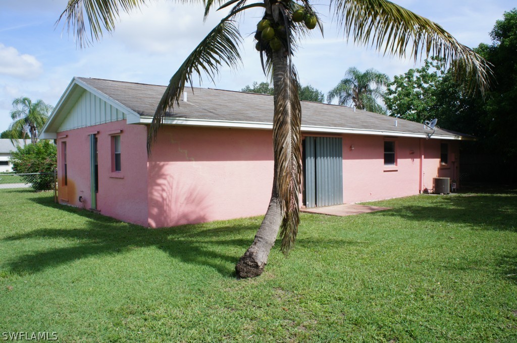118 Rowland Road Lehigh Acres, FL 33936 - Photo 8 of 19 a front view of house with yard and entertaining space
