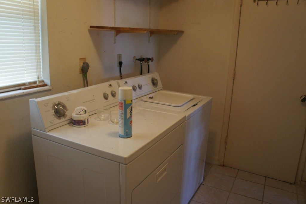 118 Rowland Road Lehigh Acres, FL 33936 - Photo 9 of 19 a utility room with dryer and washer