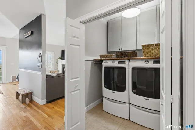 a view of kitchen with sink and refrigerator