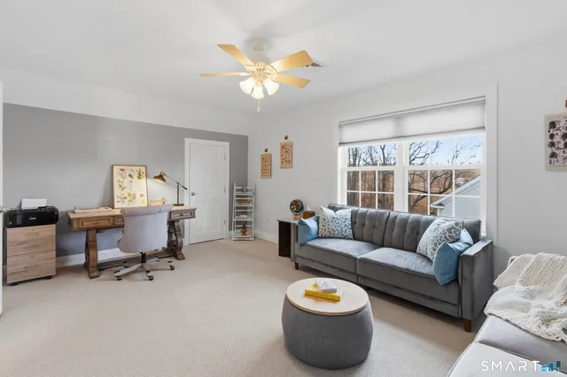 a living room with furniture and a window