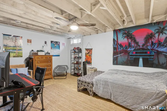 a bedroom with bed and furniture