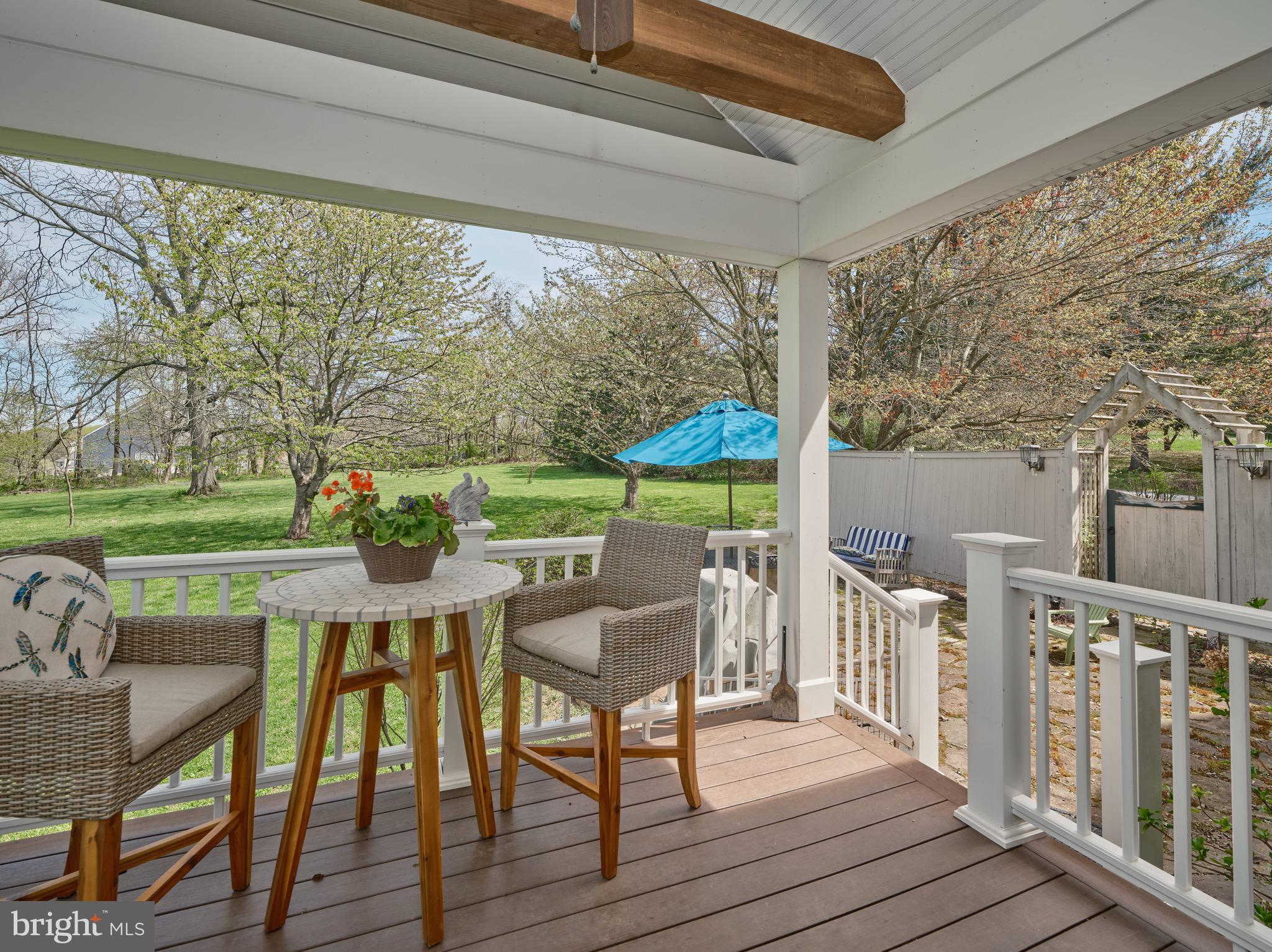 249 Ebelhare Road Pottstown, PA 19465 - Photo 15 of 47 a view of a patio with a table chairs and wooden floor