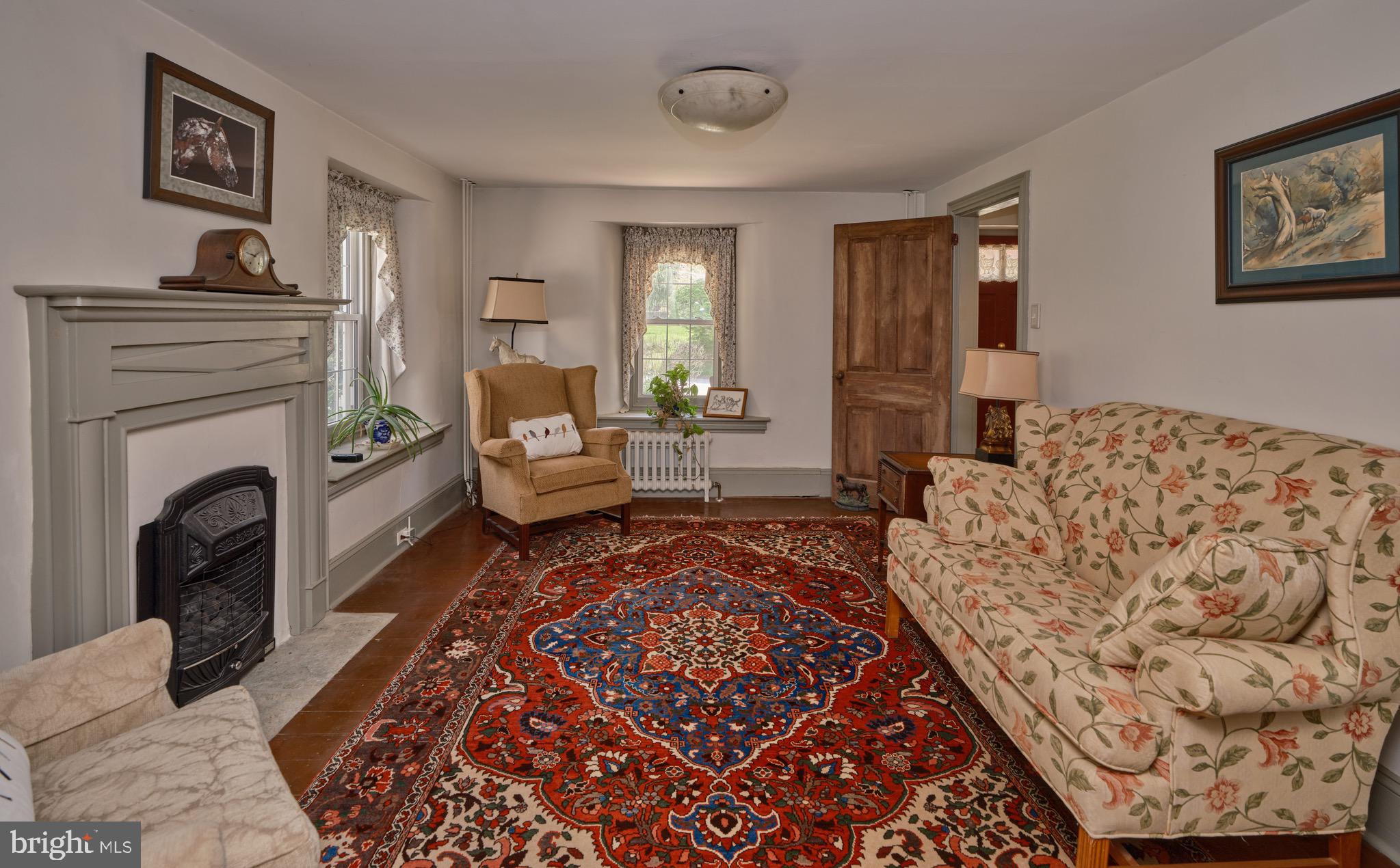 249 Ebelhare Road Pottstown, PA 19465 - Photo 20 of 47 a living room with furniture and a fireplace