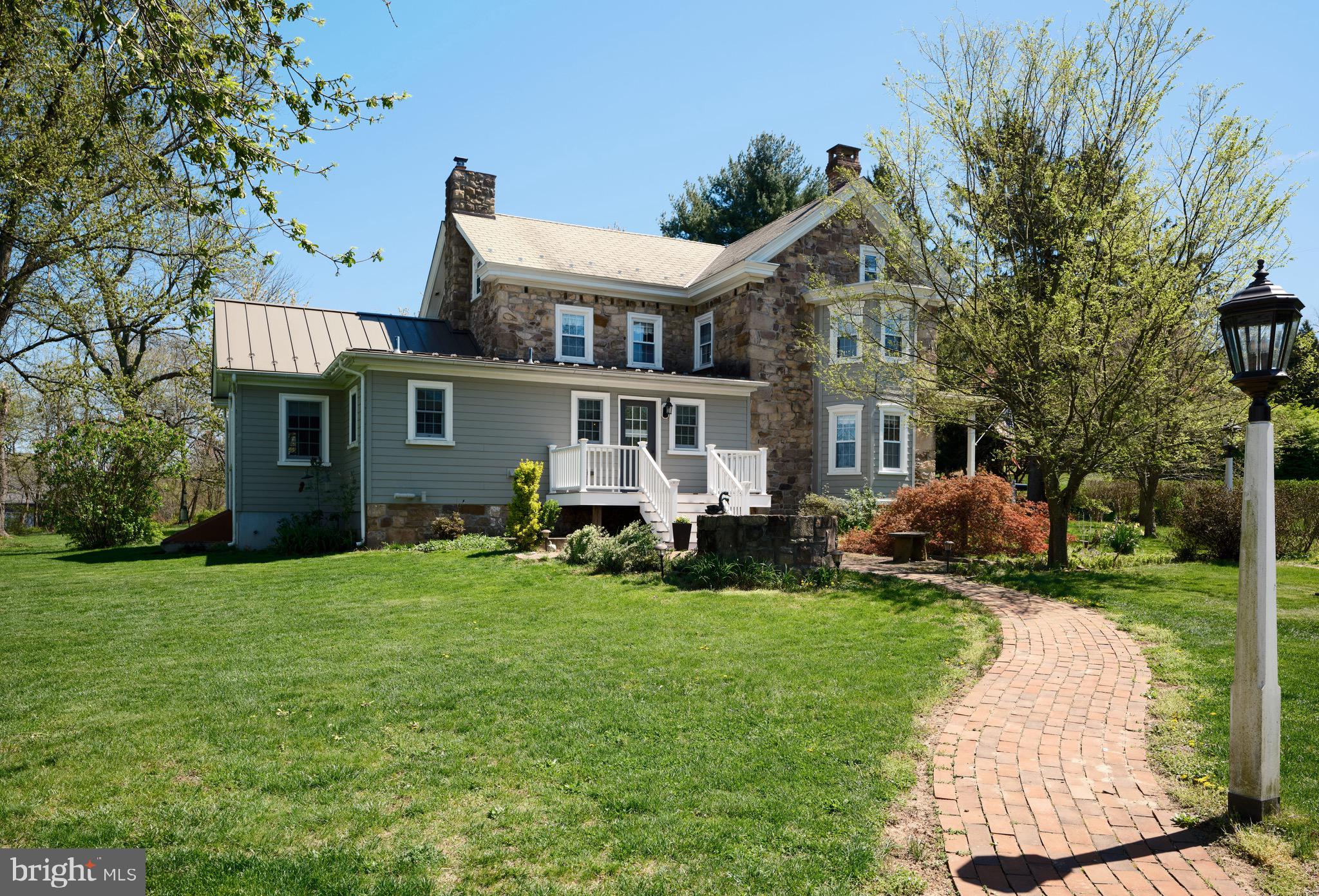 249 Ebelhare Road Pottstown, PA 19465 - Photo 42 of 47 a view of a house with a yard patio and fire pit