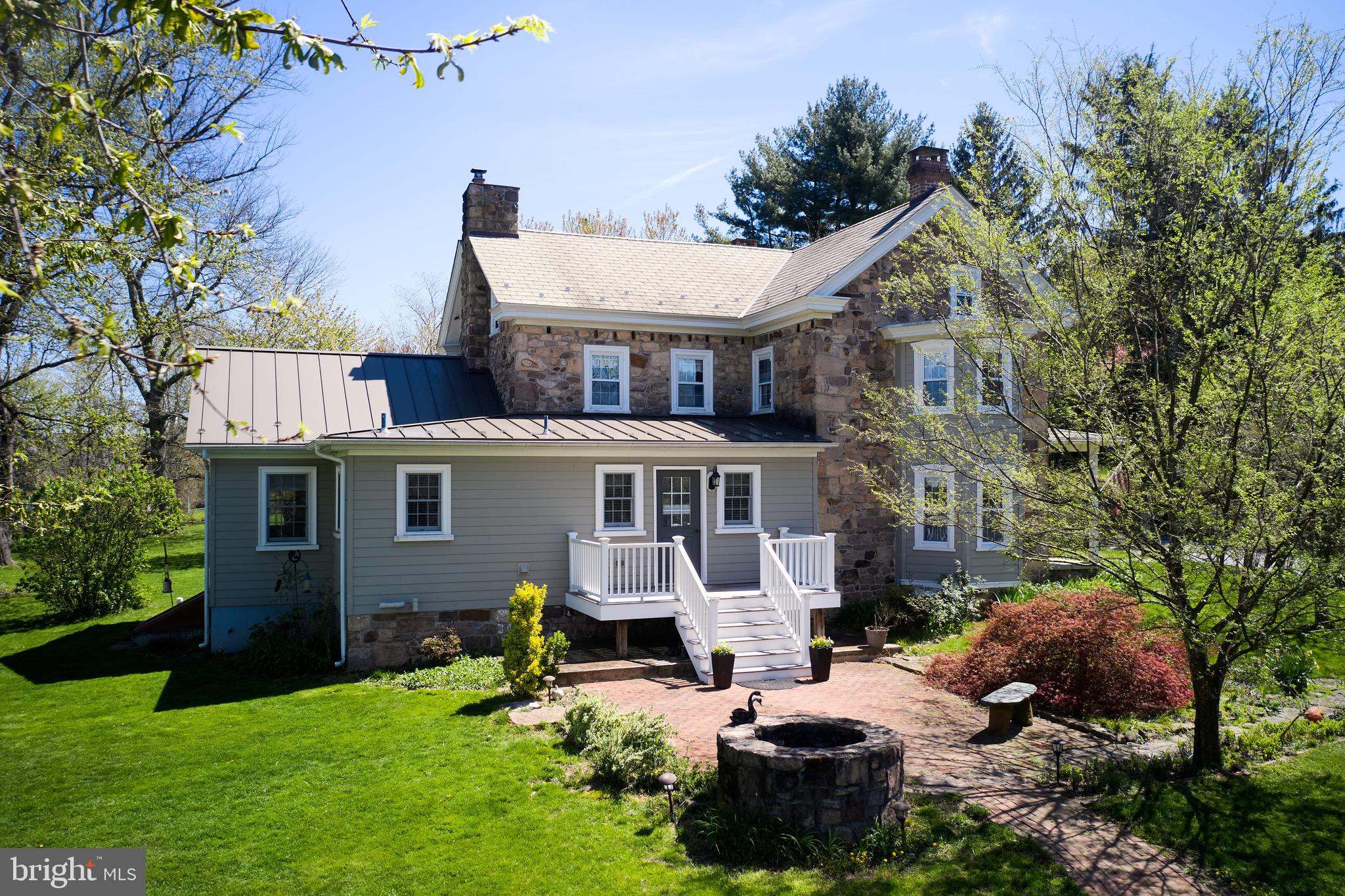 249 Ebelhare Road Pottstown, PA 19465 - Photo 44 of 47 a view of a house with a yard patio and fire pit