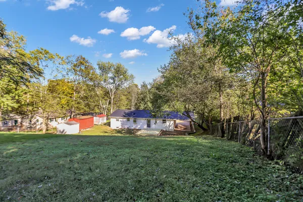 a front view of house with yard and seating area