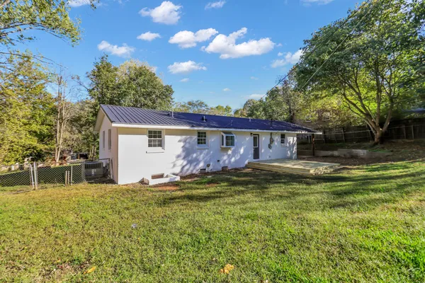 a backyard of a house with lots of green space