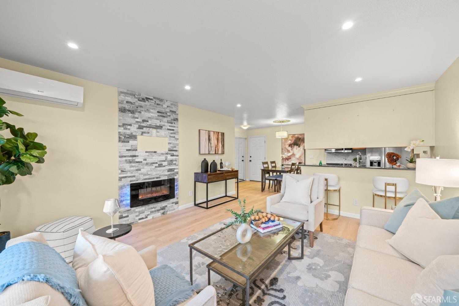 7323 Starward Drive, Unit 8 Dublin, CA 94568 - Photo 11 of 21 a living room with fireplace furniture and a fireplace