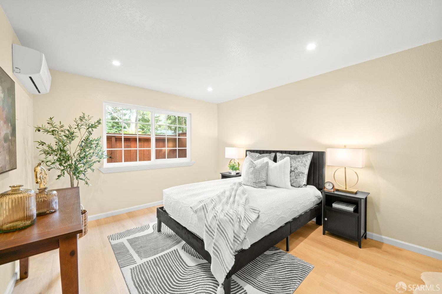 7323 Starward Drive, Unit 8 Dublin, CA 94568 - Photo 14 of 21 a bedroom with a bed lamp and a potted plant