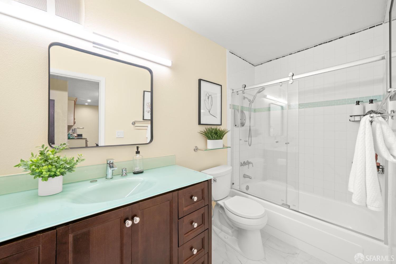 7323 Starward Drive, Unit 8 Dublin, CA 94568 - Photo 5 of 21 a bathroom with a granite countertop sink toilet and shower