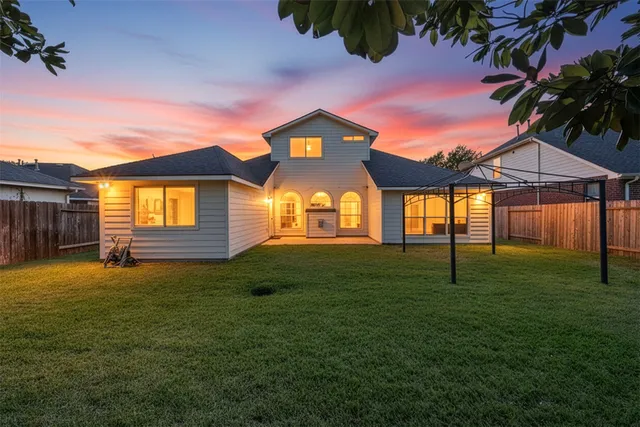a kitchen with stainless steel appliances granite countertop a sink counter space cabinets and a stove