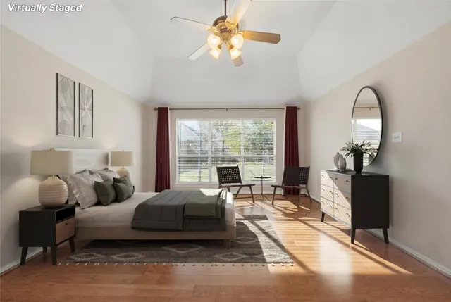 a bathroom with a sink a toilet and a large mirror
