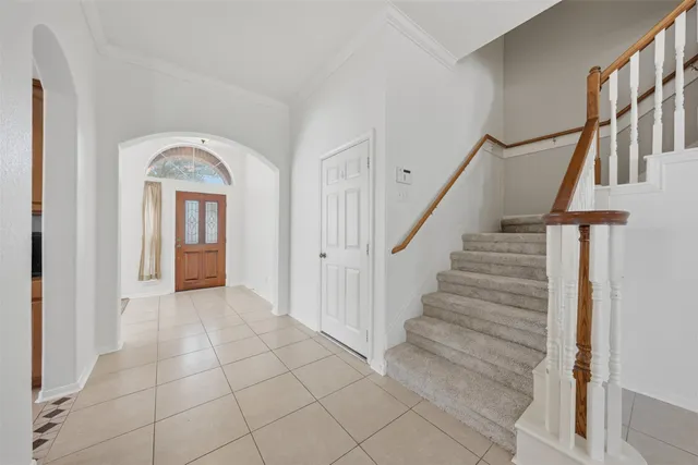 a bathroom with a sink a toilet a mirror and shower