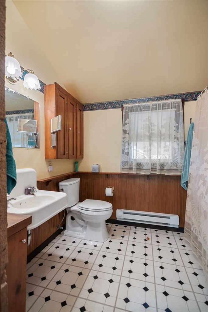 424 Moody Street Mason, TX 76856 - Photo 11 of 49 a bathroom with a sink toilet and shower
