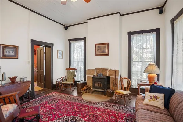 a view of a dining room with furniture and chandelier