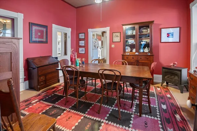 a view of a dining room with furniture and a rug
