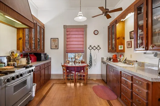 a kitchen that has a cabinets counter space and a table in it