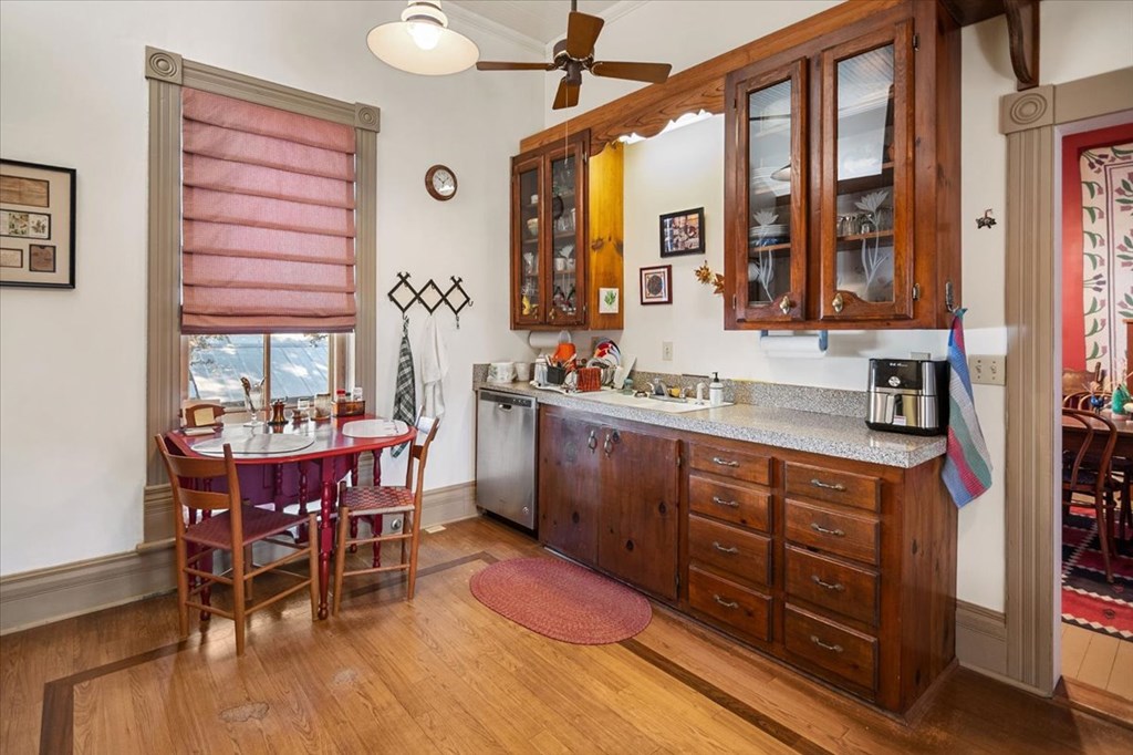 424 Moody Street Mason, TX 76856 - Photo 19 of 49 a kitchen that has a cabinets counter space and a table in it