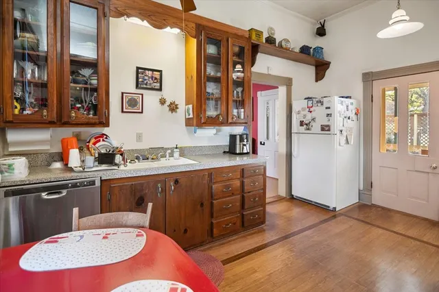 a kitchen with stove and cabinets