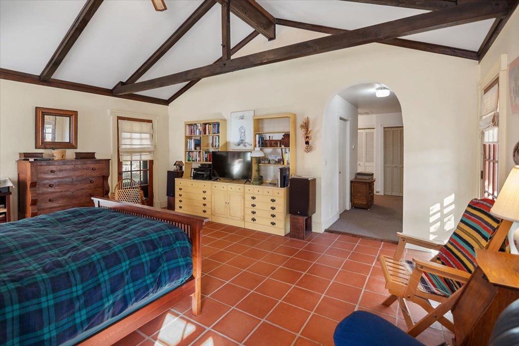 424 Moody Street Mason, TX 76856 - Photo 24 of 49 a large bedroom with a bed and wooden floor