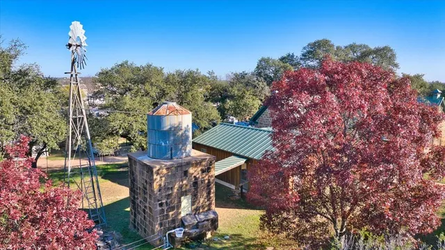 a view of a backyard with sitting area