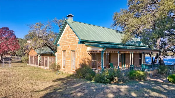 a view of house with yard