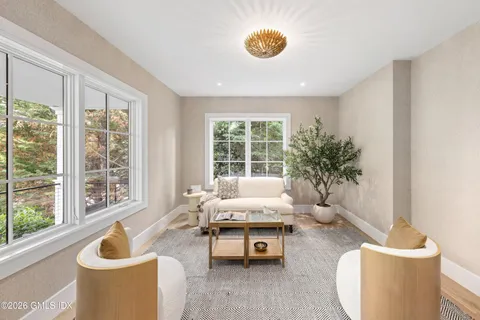 a living room with furniture and window