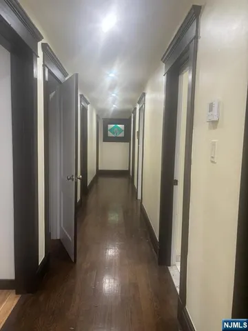a view of hallway with stainless steel appliances