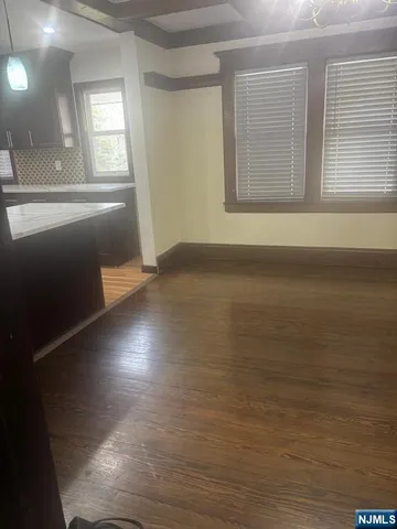 a large bathroom with a large mirror vanity and a shower