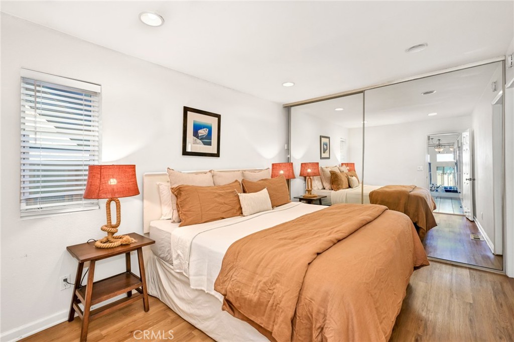 4103 Seashore Drive Newport Beach, CA 92663 - Photo 31 of 62 a bed room with two beds and a lamp