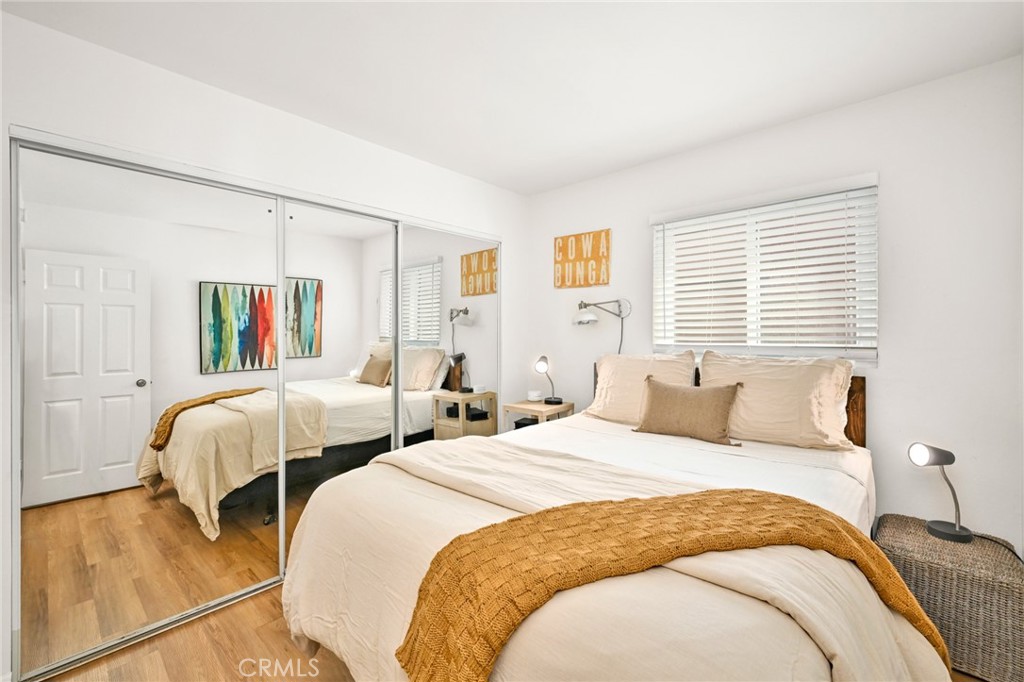 4103 Seashore Drive Newport Beach, CA 92663 - Photo 34 of 62 a bedroom with two beds and a large window