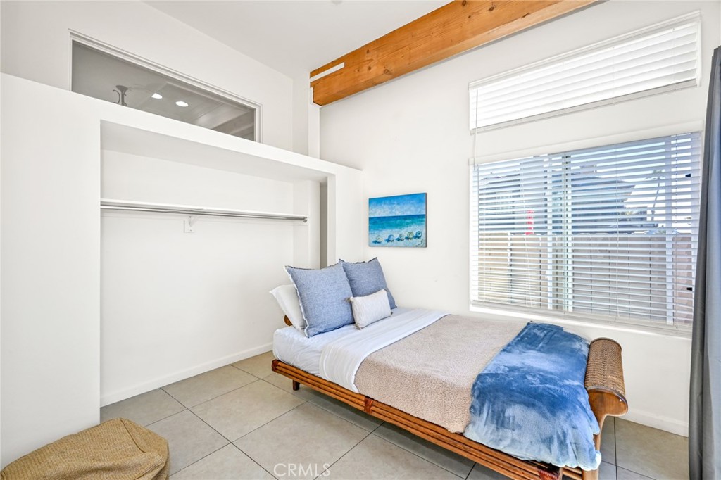 4103 Seashore Drive Newport Beach, CA 92663 - Photo 39 of 62 a bed sitting in a bedroom next to a window