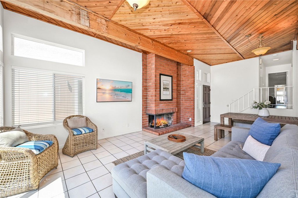 4103 Seashore Drive Newport Beach, CA 92663 - Photo 42 of 62 a living room with furniture and a rug