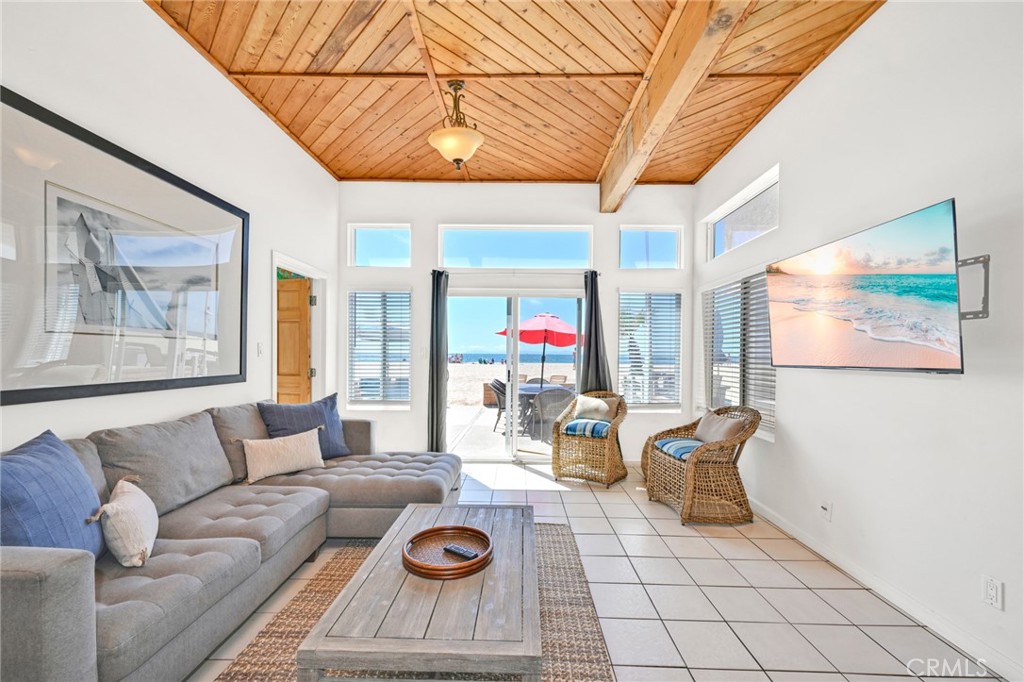 4103 Seashore Drive Newport Beach, CA 92663 - Photo 44 of 62 a living room with furniture and wooden floor