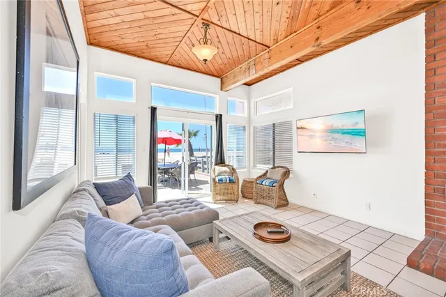 a view of a patio with couches and pool