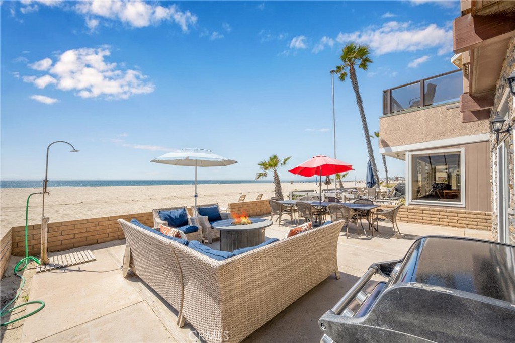 4103 Seashore Drive Newport Beach, CA 92663 - Photo 51 of 62 a living room with furniture flowerpot and a chandelier