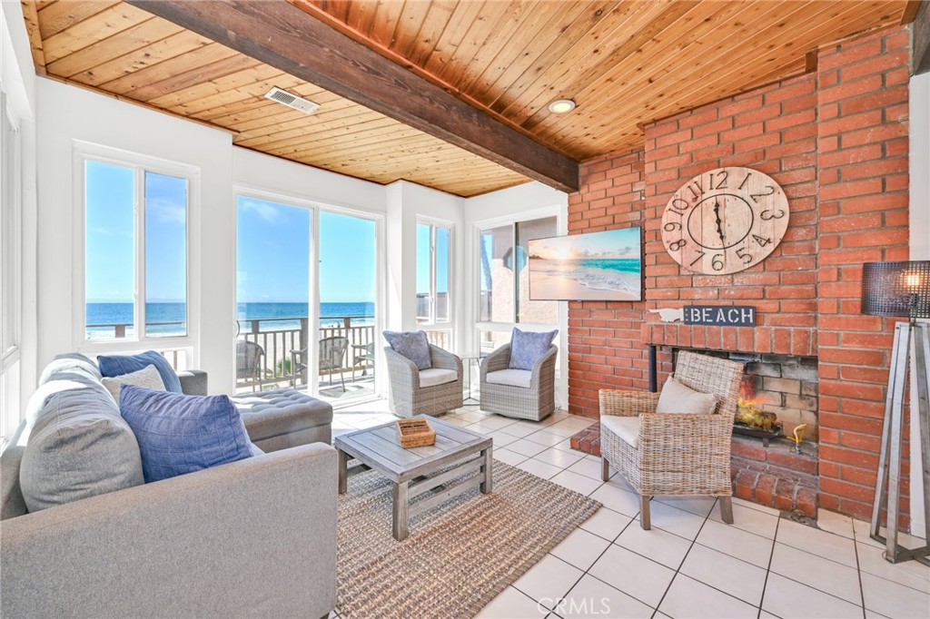 4103 Seashore Drive Newport Beach, CA 92663 - Photo 6 of 62 a living room with furniture and a large window
