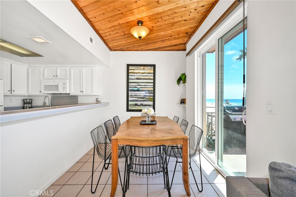 4103 Seashore Drive Newport Beach, CA 92663 - Photo 8 of 62 a dining room with furniture and window
