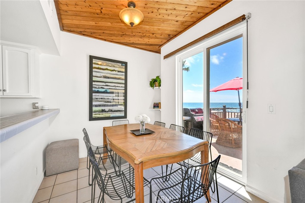 4103 Seashore Drive Newport Beach, CA 92663 - Photo 9 of 62 a view of a dining room with furniture and window
