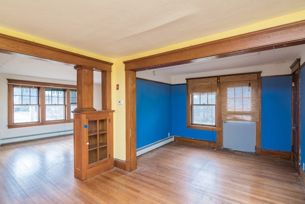 110 Old Amherst Road Sunderland, MA 01375 - Photo 12 of 41 an empty room with wooden floor and windows