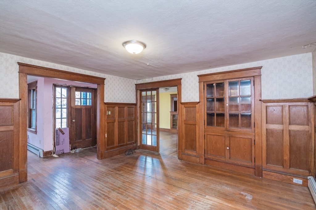 110 Old Amherst Road Sunderland, MA 01375 - Photo 13 of 41 an empty room with wooden floor and windows