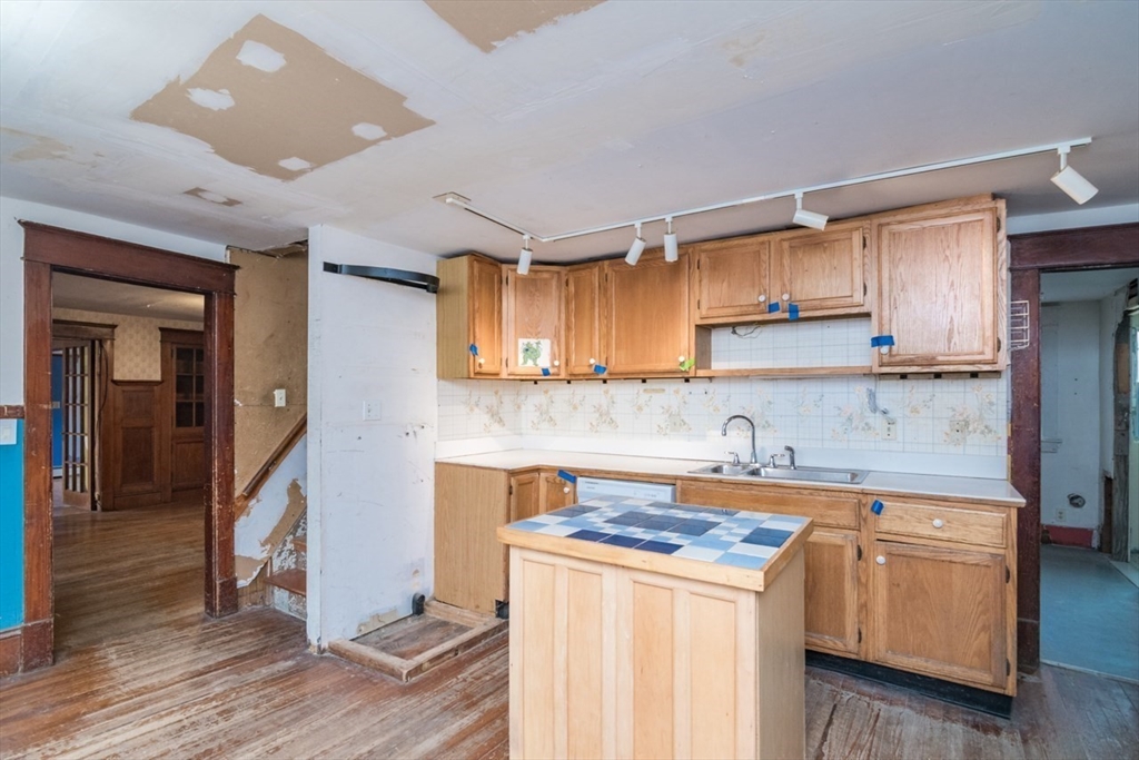110 Old Amherst Road Sunderland, MA 01375 - Photo 17 of 41 a kitchen with a sink cabinets and wooden floor