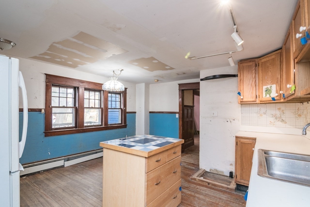 110 Old Amherst Road Sunderland, MA 01375 - Photo 18 of 41 a kitchen with a stove and a refrigerator